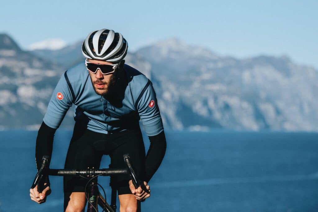 Man on a race bike in the mountains wearing Castelli sportswear